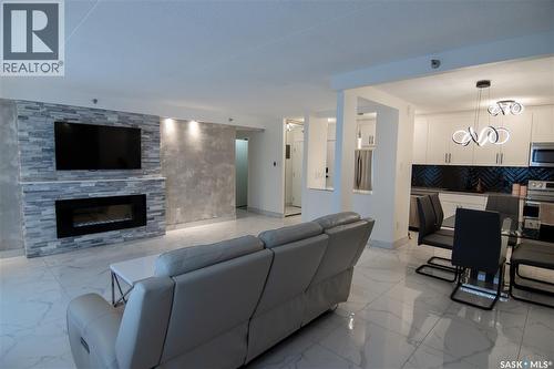 221 4045 Rae Street, Regina, SK - Indoor Photo Showing Living Room With Fireplace