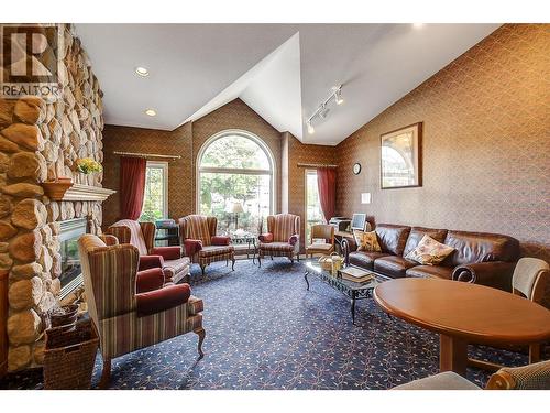Lounge (clubhouse) - 2330 Butt Road Unit# 449, West Kelowna, BC - Indoor Photo Showing Living Room With Fireplace