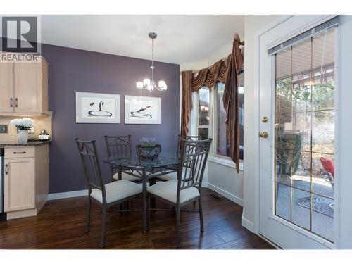 Kitchen table looks out to nature. - 2330 Butt Road Unit# 449, West Kelowna, BC - Indoor Photo Showing Dining Room