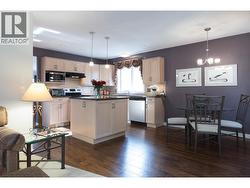 Open plan kitchen/dining area and family room. - 