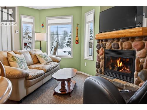 400 Riverside Way Unit# 438, Fernie, BC - Indoor Photo Showing Living Room With Fireplace