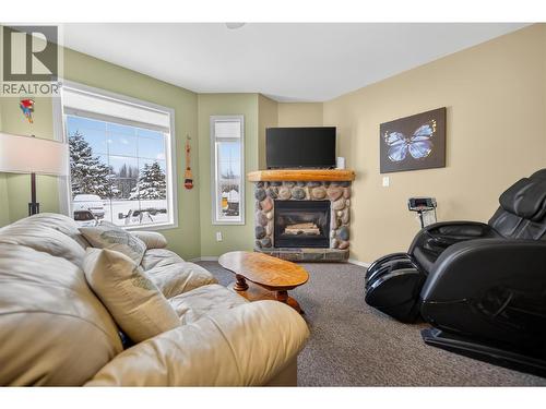 400 Riverside Way Unit# 438, Fernie, BC - Indoor Photo Showing Living Room With Fireplace