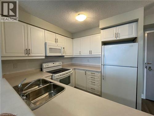 2155 Burnhamthorpe Road W Unit# 1508, Mississauga, ON - Indoor Photo Showing Kitchen With Double Sink