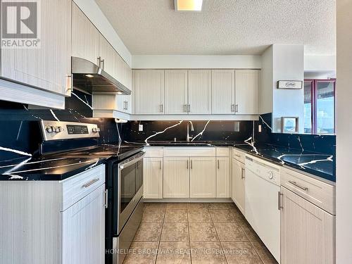 Custom Kitchen Countertops - 1709 - 2155 Burnhamthorpe Road W, Mississauga, ON - Indoor Photo Showing Kitchen With Double Sink