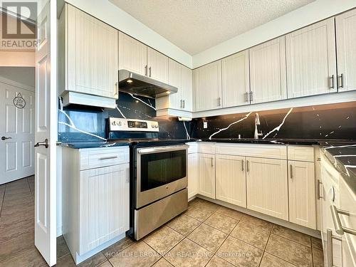 Custom Kitchen Countertops - 1709 - 2155 Burnhamthorpe Road W, Mississauga, ON - Indoor Photo Showing Kitchen With Double Sink