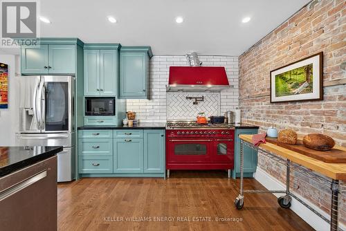 Loads of storage. Stunning brick wall - 339 Elmbrook Road, Prince Edward County (Sophiasburg Ward), ON - Indoor Photo Showing Kitchen With Upgraded Kitchen