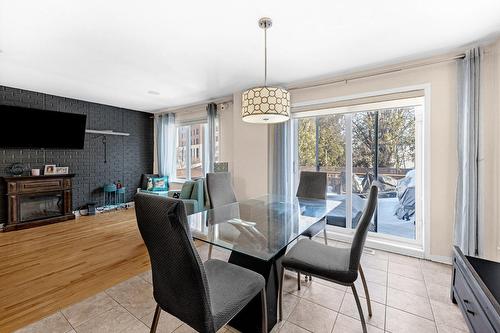 Salle à manger - 2070 Rue Des Sarcelles, Vaudreuil-Dorion, QC - Indoor Photo Showing Dining Room With Fireplace