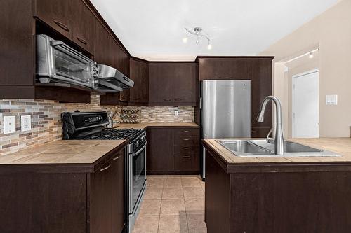 Cuisine - 2070 Rue Des Sarcelles, Vaudreuil-Dorion, QC - Indoor Photo Showing Kitchen With Double Sink