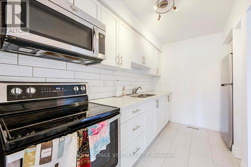 8 - 301 Washburn Way, Toronto, ON - Indoor Photo Showing Kitchen With Double Sink