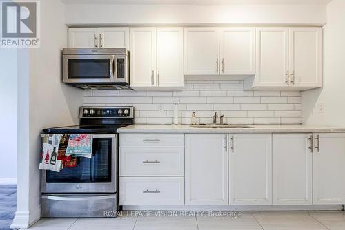 8 - 301 Washburn Way, Toronto, ON - Indoor Photo Showing Kitchen With Double Sink