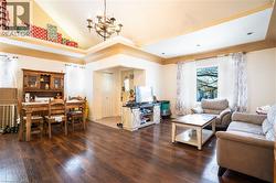 Living room featuring high vaulted ceiling - 