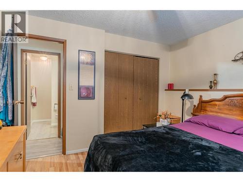 108 Colley Street, Warfield, BC - Indoor Photo Showing Bedroom