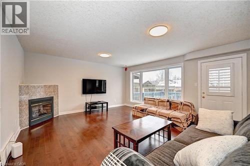 242 Doon Mills Drive, Kitchener, ON - Indoor Photo Showing Living Room With Fireplace