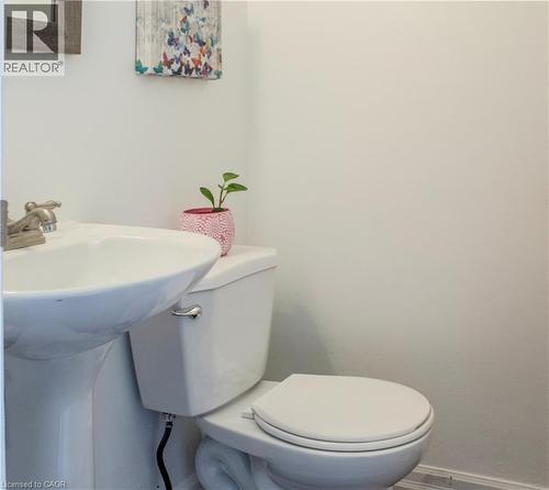 Half bath featuring baseboards and toilet - 48 Riverdale Drive Unit# 2, Hamilton, ON - Indoor Photo Showing Bathroom