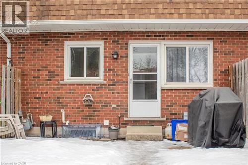 Doorway to property with roof with shingles and brick siding - 48 Riverdale Drive Unit# 2, Hamilton, ON - Outdoor With Exterior