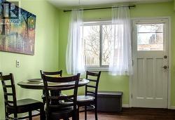 Dining space featuring wood finished floors and healthy amount of natural light - 