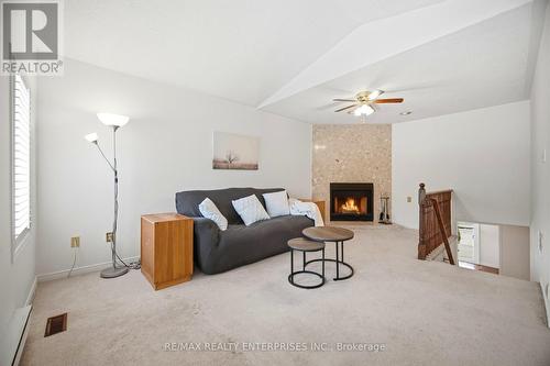 Family Room is large and bright - 1104 Feeley Court, Mississauga, ON - Indoor With Fireplace