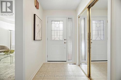 Bright foyer features large closet and bench area - 1104 Feeley Court, Mississauga, ON - Indoor Photo Showing Other Room