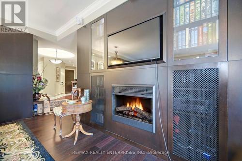 Electric Fireplace and Built in Cabinetry - 513 - 2855 Bloor Street W, Toronto, ON - Indoor With Fireplace