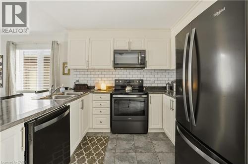 15 Irving Drive, Norwich, ON - Indoor Photo Showing Kitchen With Double Sink