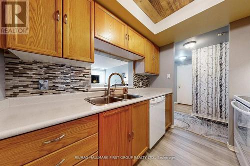 218 - 8351 Mclaughlin Road S, Brampton, ON - Indoor Photo Showing Kitchen With Double Sink