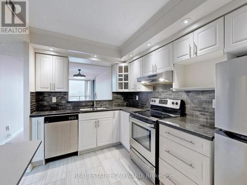 Updated Kitchen with Granite Countertops - 1116 - 4725 Sheppard Avenue E, Toronto, ON - Indoor Photo Showing Kitchen With Stainless Steel Kitchen With Double Sink With Upgraded Kitchen