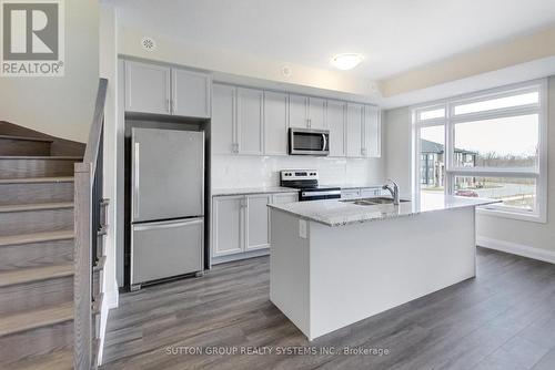 109 - 1573 Rose Way, Milton, ON - Indoor Photo Showing Kitchen With Stainless Steel Kitchen With Double Sink With Upgraded Kitchen