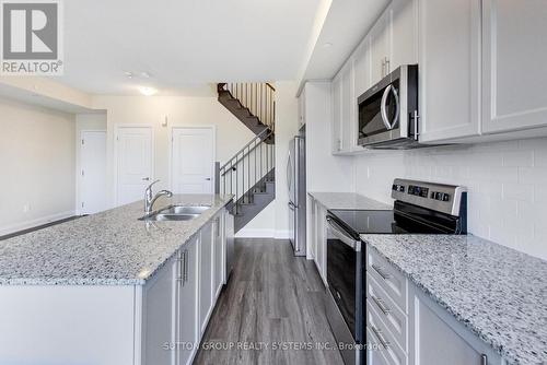 109 - 1573 Rose Way, Milton, ON - Indoor Photo Showing Kitchen With Double Sink With Upgraded Kitchen
