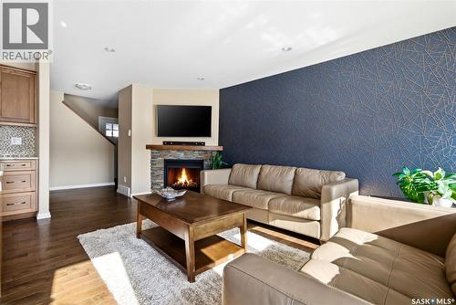 5221 Watson Way, Regina, SK - Indoor Photo Showing Living Room With Fireplace