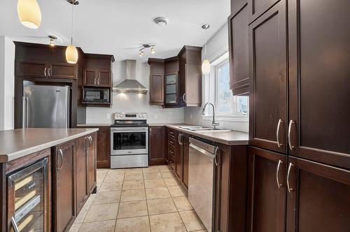 Cuisine - 101-2365 Rue Versailles, Mascouche, QC - Indoor Photo Showing Kitchen With Double Sink With Upgraded Kitchen
