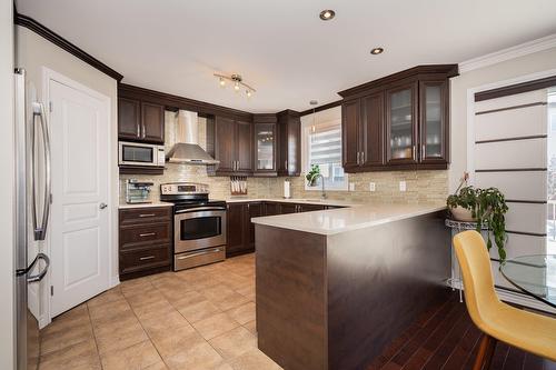 Cuisine - 4665 Rue Gaston-Chapleau, Laval (Chomedey), QC - Indoor Photo Showing Kitchen With Upgraded Kitchen