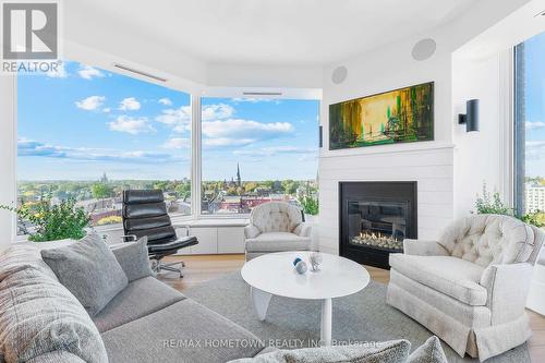 1205 - 15 St Andrew Street, Brockville, ON - Indoor Photo Showing Living Room With Fireplace