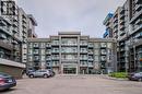 460 Dundas Street Unit# 1212, Waterdown, ON  - Outdoor With Balcony With Facade 