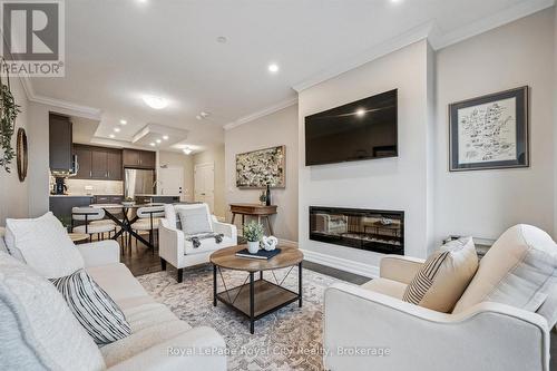 809 - 1880 Gordon Street, Guelph (Pineridge/Westminster Woods), ON - Indoor Photo Showing Living Room With Fireplace