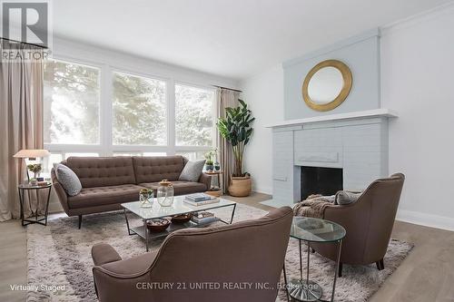 Virtually Staged - 3017 Lakefield Road, Selwyn, ON - Indoor Photo Showing Living Room With Fireplace