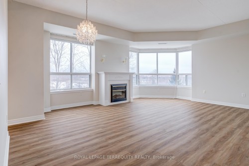 212-2085 Amherst Heights Drive, Burlington, ON - Indoor Photo Showing Living Room With Fireplace