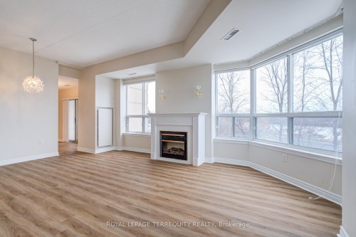 212-2085 Amherst Heights Drive, Burlington, ON - Indoor Photo Showing Other Room With Fireplace