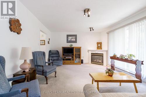 21 Forest Hill Drive, Springwater, ON - Indoor Photo Showing Living Room With Fireplace