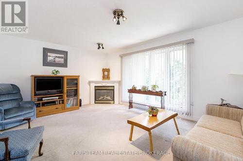21 Forest Hill Drive, Springwater, ON - Indoor Photo Showing Living Room With Fireplace