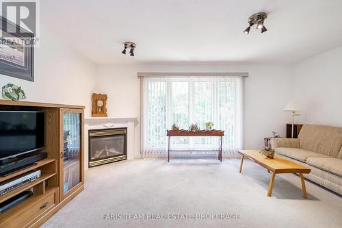 21 Forest Hill Drive, Springwater, ON - Indoor Photo Showing Living Room With Fireplace