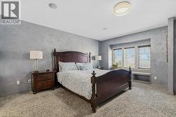 Impressive primary bedroom with walk-in closet and private ensuite - 