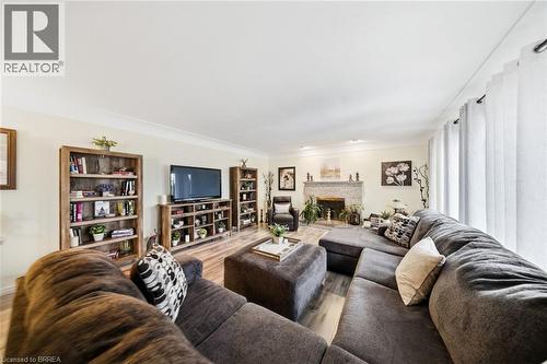15 Talbot Street, Courtland, ON - Indoor Photo Showing Living Room With Fireplace