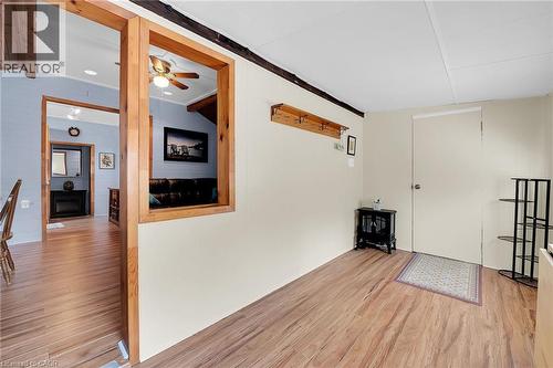 sunroom with electric fireplace and south facing windows - 17 Maple Lane, Rainham, ON - Indoor