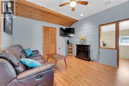 living room offers a passthrough to sunroom - 17 Maple Lane, Rainham, ON - Indoor Photo Showing Living Room With Fireplace