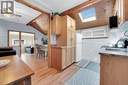 ktichen with skylight  newer fridge and stove 2023 - 