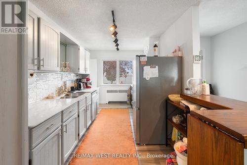 2437 Riverside Drive W, Windsor, ON - Indoor Photo Showing Kitchen With Double Sink