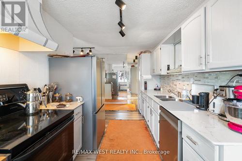 2437 Riverside Drive W, Windsor, ON - Indoor Photo Showing Kitchen With Double Sink