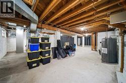 Unfinished basement featuring water heater - 
