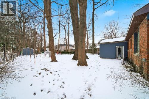 View of yard layered in snow - 276 Lakeshore Road W, Oakville, ON - Outdoor