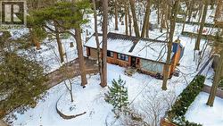 View of snow covered exterior with a chimney - 